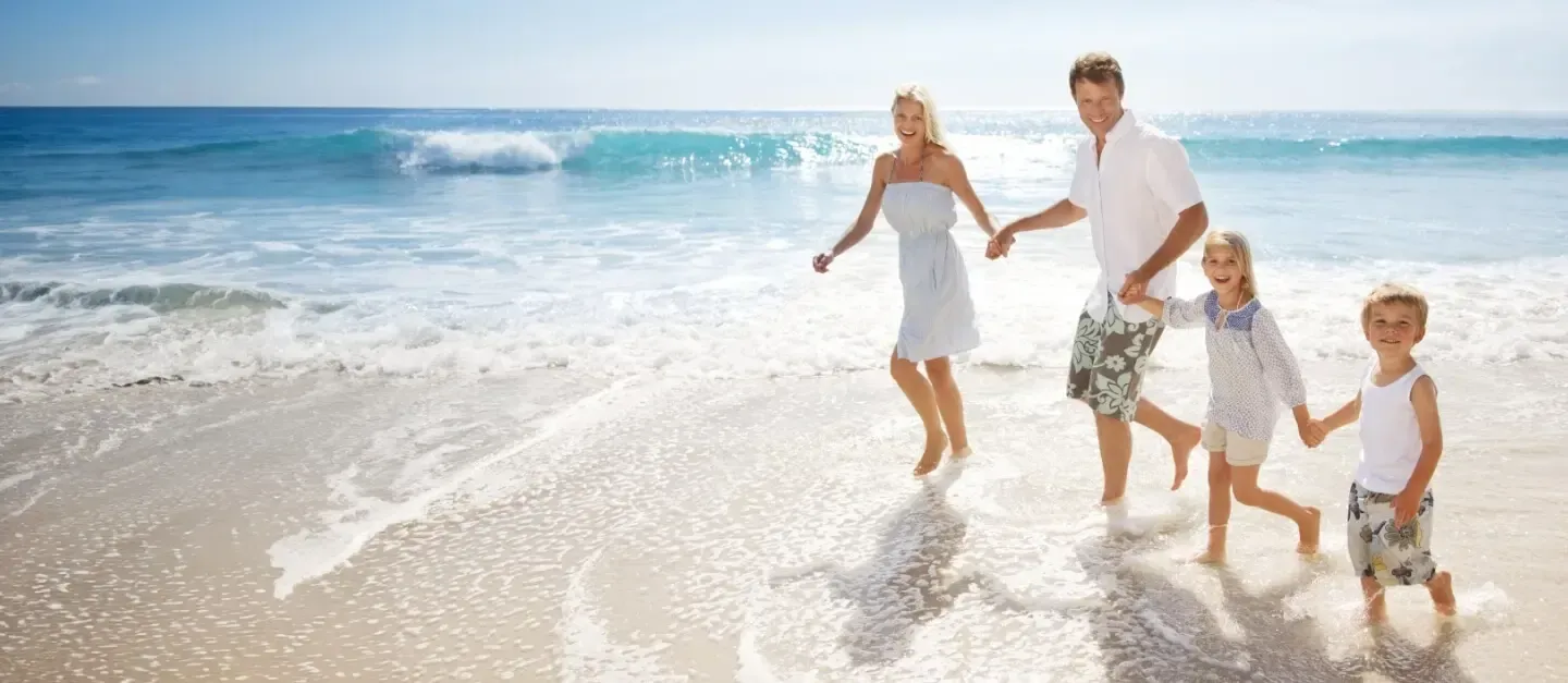 Family walking along the beach