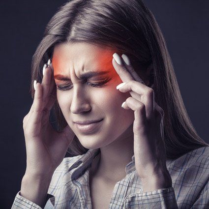 Woman experiencing a headache